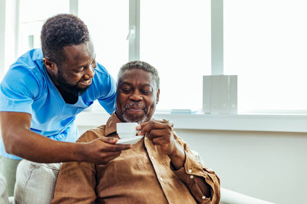 Social worker is visiting a senior man
