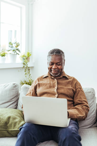 istock Using his bit of free time to do some browsing 1412852851