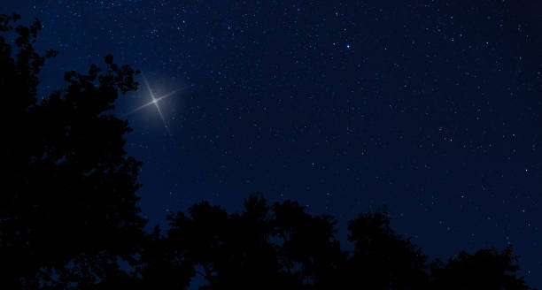 istock Bright starry night with one glowing the most 1412852875