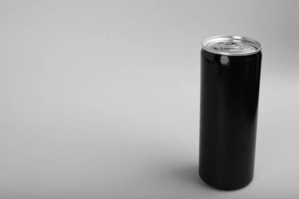 istock Black can of energy drink on light grey background. Space for text 1412855285