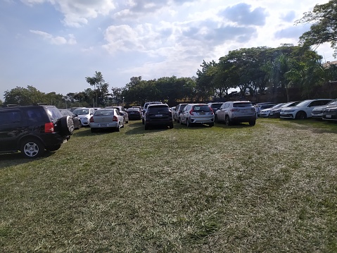 Cars parked in a big parking lot in an open space in the city of Indaiatuba, Shot in SP, Brazil.