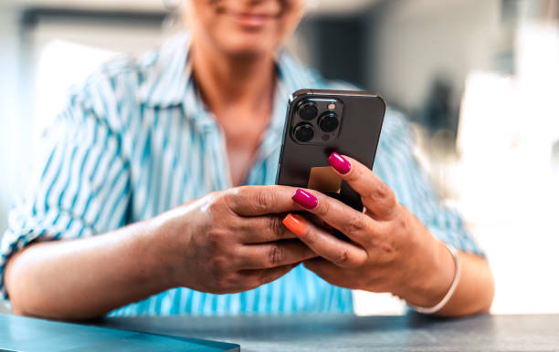 istock Hand of woman using smartphone, Space for text or design. 1412856848