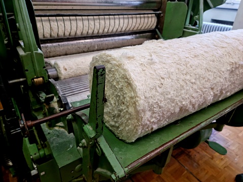 Cotton fleece - the product after cotton comes from the mixing machine. The image shows as close-up how cotton is prepared for further working steps.