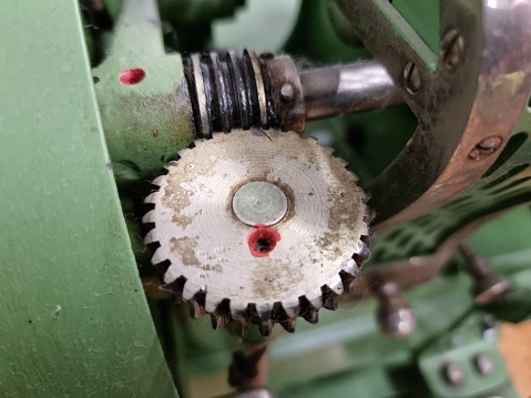 Close-up of a textile machine. Captured on a collection of old cotton prcessing machines.