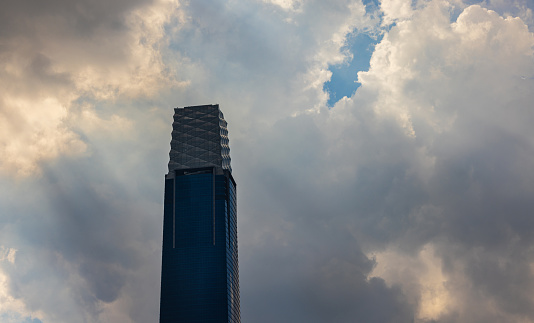 Kuala Lumpur, Malaysia -  June 14, 2022: Dark rain clouds moving over the Exchange 106 skyscraper. The TRX or signature tower. Symbol of 1MDB and Tun Razak Exchange financial crisis . Iconic building