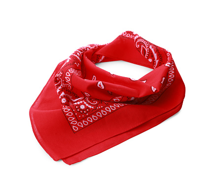 Folded red bandana with paisley pattern isolated on white