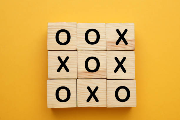 istock Tic tac toe cube set on yellow background, flat lay 1412860041