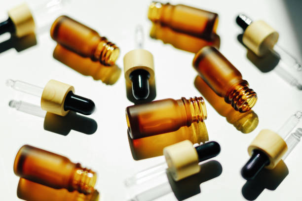 istock Amber bottle with serum or essential oil 1412862253