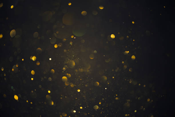 istock Golden glitter bokeh shiny dust particles lights 1412863256