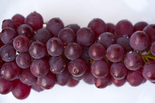 Macro takes a picture of a bunch of grapes.