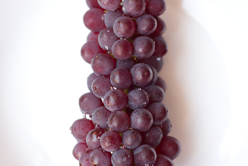 Macro takes a picture of a bunch of grapes.