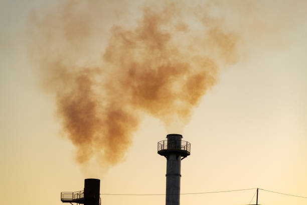 istock Factory smoke polluting the air. 1412865568