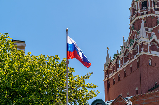 Moscow, Russia , the national flag of the Russian Federation at the ancient walls of the Kremlin.