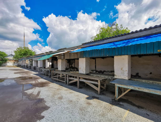 istock Old shopping malls against the blue sky with clouds on a sunny day 1412865653