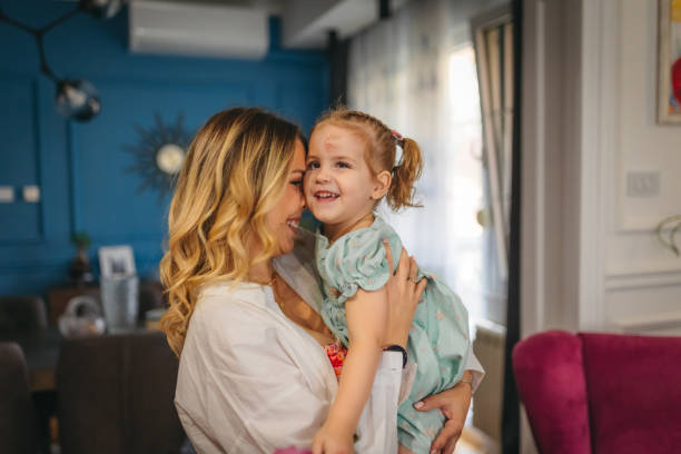 istock Girl feeling safe at her mother's arms 1412866845