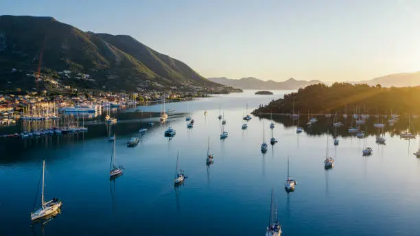 Early morning in Nydri town on Lefkada island, Greece. This bay attracts a large number of tourists on yachts and sailboats with its beauty and as good shelter from the prevailing winds