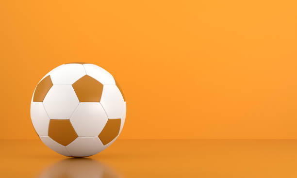 istock Soccer Ball on Orange Background 1412869301
