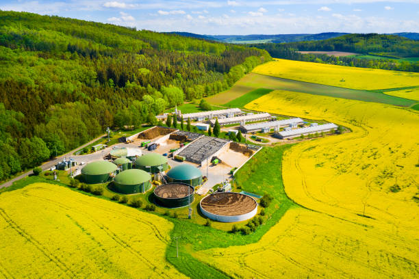 istock Biogas plant in agricultural landscape. 1412869395