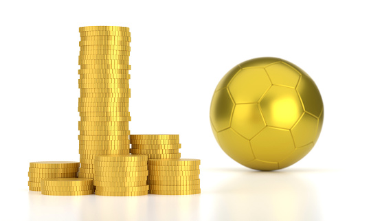 Golden soccer ball and coins on white background. Sports Betting Concept.