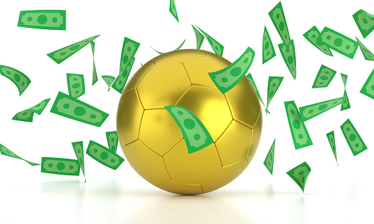 Golden soccer ball on white background and banknotes falling from above. Sports Betting Concept.