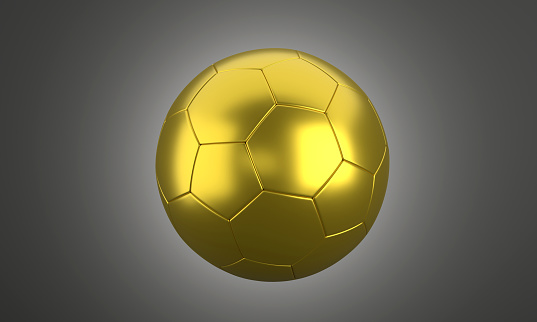 Golden soccer ball on a dark background. Sports concept.