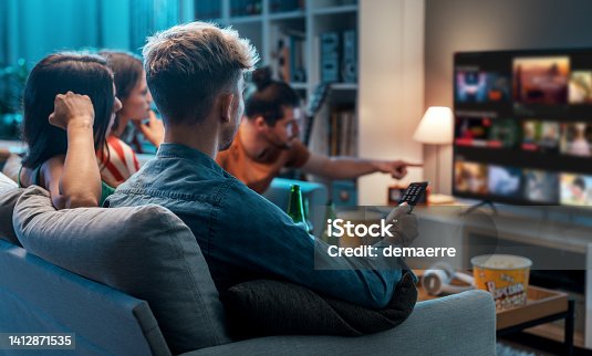 istock Friends watching movies together at home 1412871535