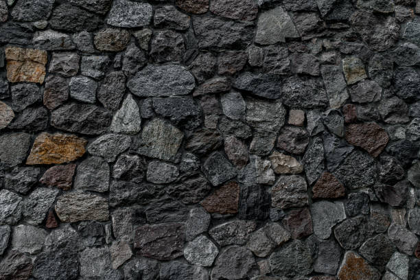 istock wall with masonry of various stones. Background and texture of stone wall surface 1412871621