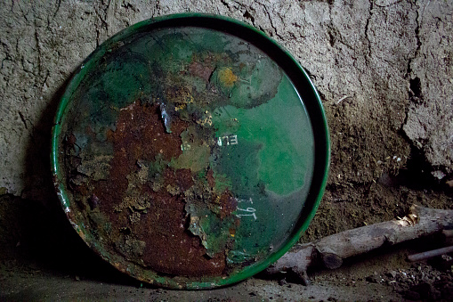 Rusty green iron barrel cover