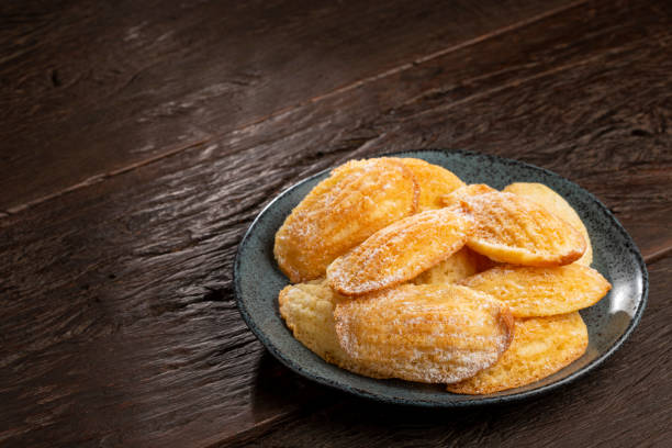 istock Traditional madeleines with sprinkled sugar. 1412873278