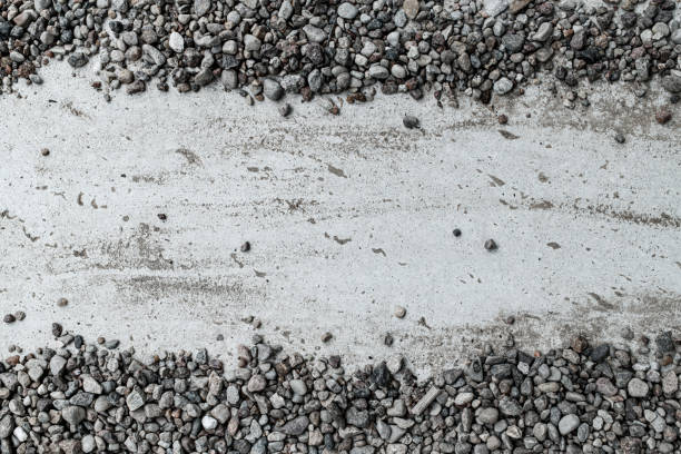 istock beautiful horizontal background with a concrete slab and small gray pebbles 1412873361