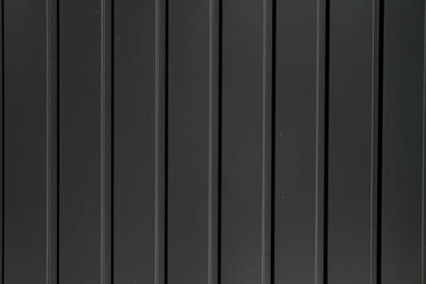 Texture of grey metal profiled sheet fence decking. Corrugated metal sheet texture background. Texture of grey metal profiled sheet fence decking. Abstract background corrugated metal fence ideas stock pictures, royalty-free photos & images