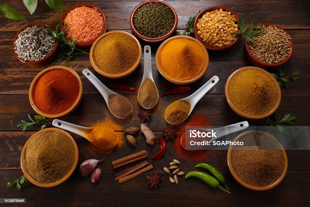 Herbs and Spices A selection of herbs and spices including Red and Green Chilli Turmeric Cumin Garam Masala making for savory cuisine Spice Stock Photo