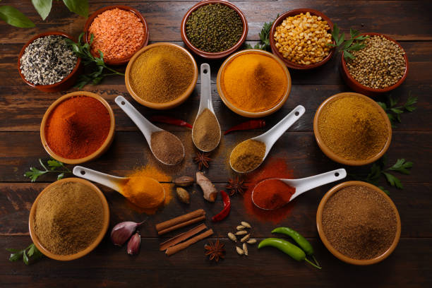 Herbs and Spices A selection of herbs and spices including Red and Green Chilli Turmeric Cumin Garam Masala making for savory cuisine condiment stock pictures, royalty-free photos & images