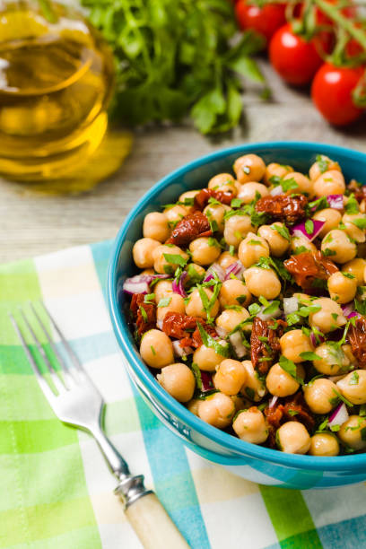 istock Chickpeas salad with onion and dried tomatoes. 1412878220