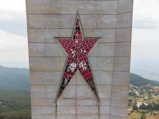 Big red star on an abandoned soviet monument Buzludzha made in the style of brutalism, aerial view, Bulgaria