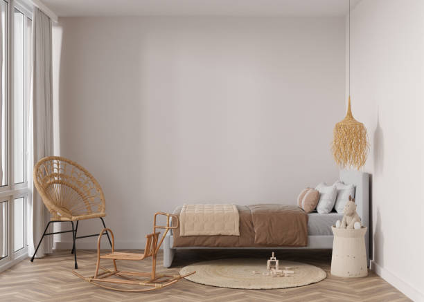 istock Empty wall in modern child room. Mock up interior in boho style. Free, copy space for your picture or poster. Bed, rattan chair, carpet, toys. Cozy room for kids. 3D rendering. 1412879614