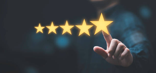 istock Businessman touching glowing yellow five stars for excellent evaluate after customer use product service , ISO and quality standard certificate concept. 1412879660