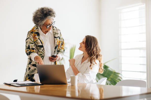 istock Mature manager having a discussion with her colleague in an office 1412879756