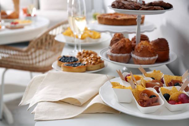istock Variety of snacks on white table in buffet style indoors 1412879851
