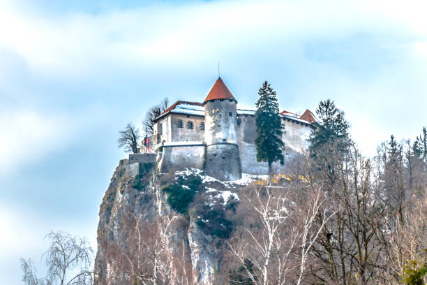 bled castle - castle slovenia winter snow stock-fotos und bilder