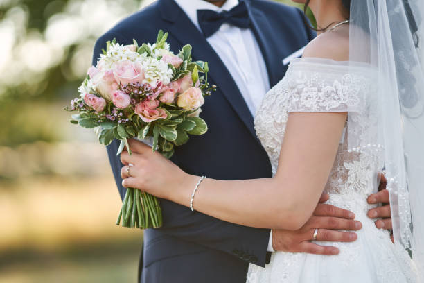 istock Happy bride and groom hugging each other on their wedding day 1412883697