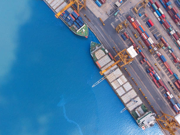 istock cargo ship Logistics and transportation of International Container Cargo ship and cargo plane in the ocean a Freight Transportation, Shipping at the port 1412884187