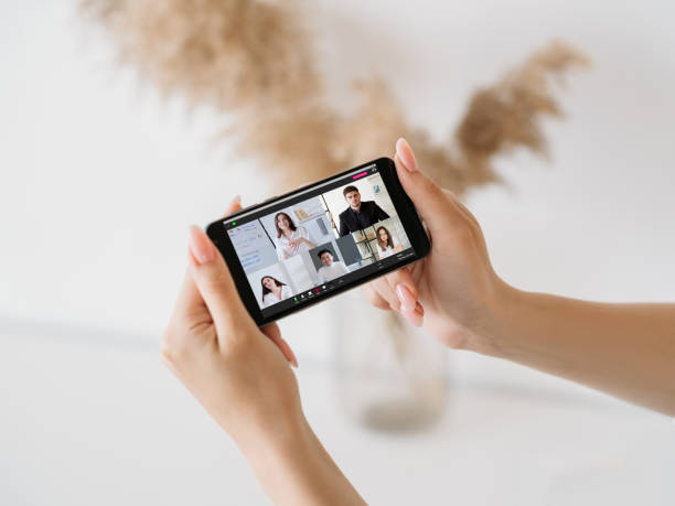istock mobile conference video chat business team phone 1412886018