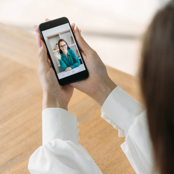 istock video chat mobile conference business woman waving 1412886028