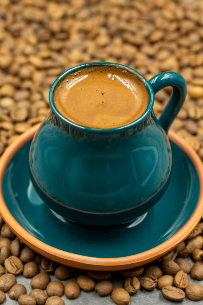 istock Turkish coffee in a rustic cup. Coffee beans background. close up 1412886312