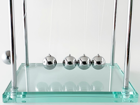 Newton's cradle on white background