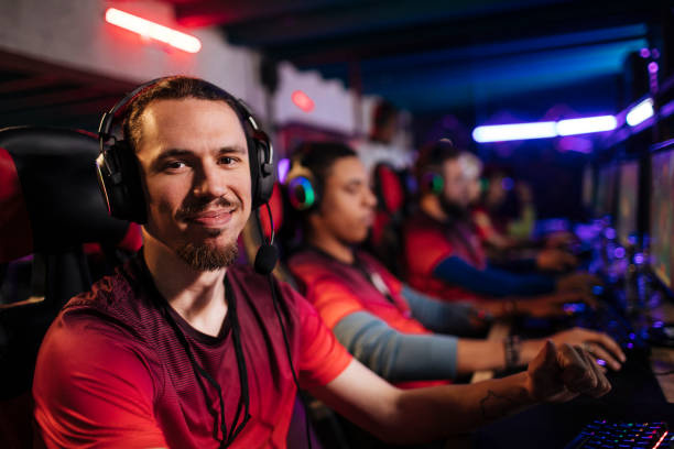 istock Young gamer with his team 1412888441