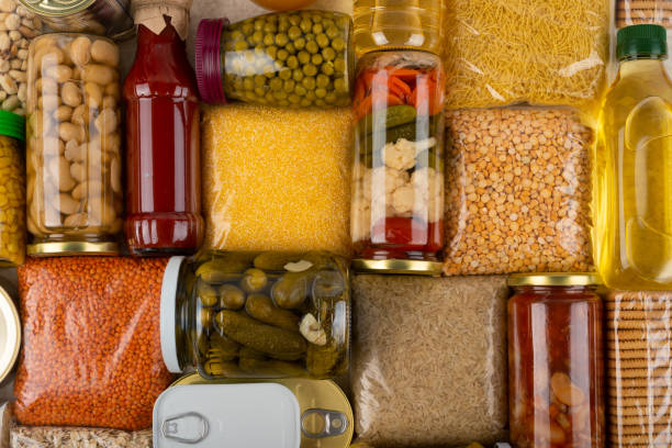 istock Emergency survival groceries on kitchen table closeup flat lay 1412889513
