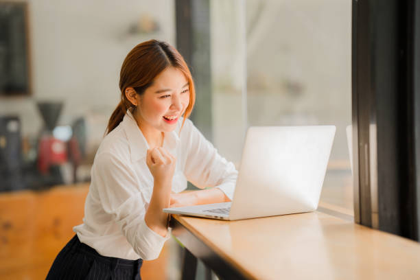 istock Young Asian Woman Using Laptop 1412891842