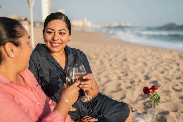 Lesbian couple on a romantic date on the beach